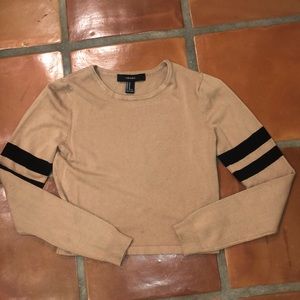 Tan long sleeve shirt.